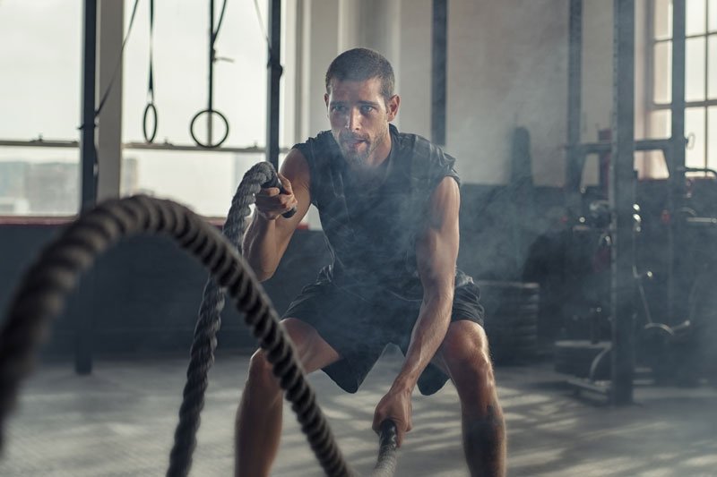 a man using fray fitness battle ropes to get a cardio workout
